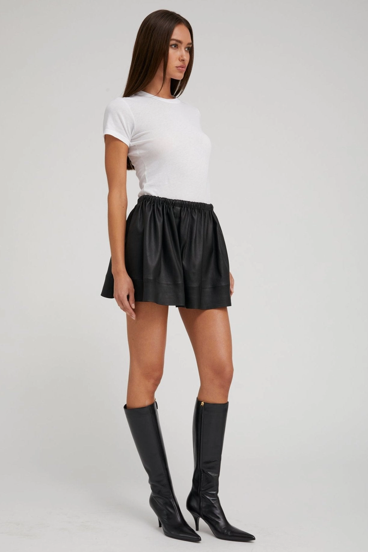 Bold Print Black Leather Bell Mini Skirt